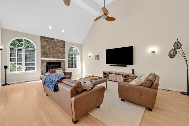 Fireplace, Interior, Living room, Recessed Lighting, Stone Walls, Wood Texture Flooring