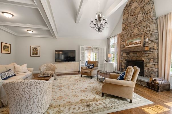 Chandelier, Fireplace, Interior, Living room, Stone Walls, Wood Texture Flooring