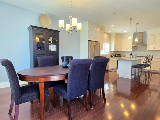 Chandelier, Dining room, Interior, Kitchen, Pendant Lights, Recessed Lighting, Stainless Steel Appliances, Wood Texture Flooring