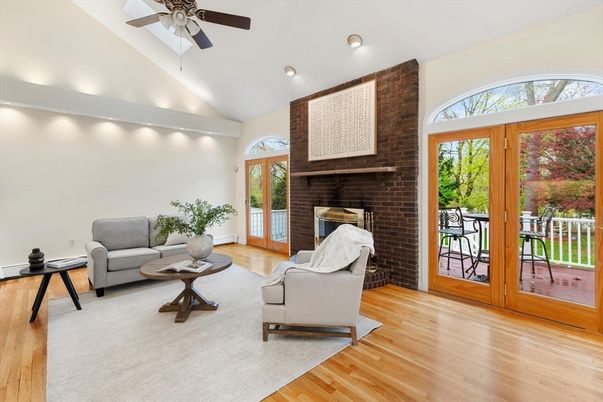 Fireplace, Interior, Living room, Recessed Lighting, Stone Walls, Wood Texture Flooring