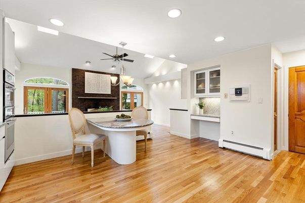Dining room, Fireplace, Interior, Recessed Lighting, Stone Walls, Wood Texture Flooring