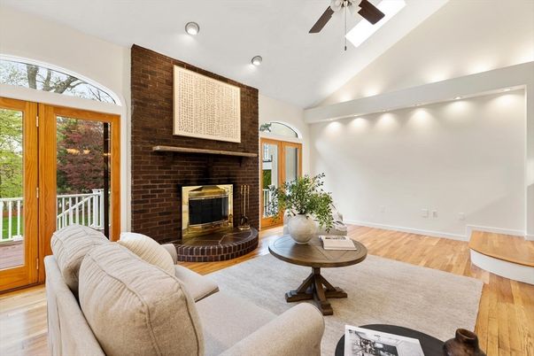 Fireplace, Interior, Living room, Recessed Lighting, Stone Walls, Wood Texture Flooring
