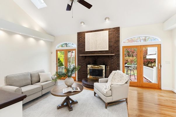 Fireplace, Interior, Living room, Recessed Lighting, Stone Walls, Wood Texture Flooring