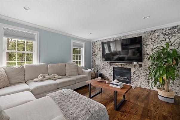 Fireplace, Interior, Living room, Recessed Lighting, Stone Walls, Wood Texture Flooring