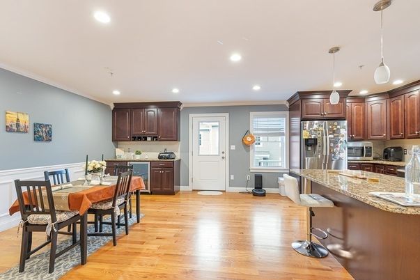 Dining room, Interior, Kitchen, Pendant Lights, Recessed Lighting, Stainless Steel Appliances, Wood Texture Flooring