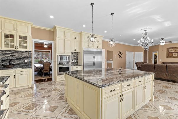 Chandelier, Dining room, Interior, Kitchen, Living room, Pendant Lights, Recessed Lighting, Stainless Steel Appliances