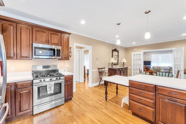 Dining room, Interior, Kitchen, Pendant Lights, Recessed Lighting, Stainless Steel Appliances, Wood Texture Flooring