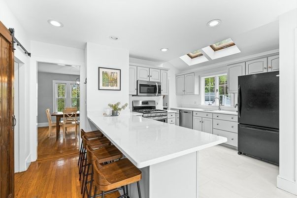 Dining room, Interior, Kitchen, Recessed Lighting, Stainless Steel Appliances, Wood Texture Flooring