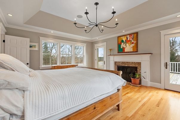 Bedroom, Chandelier, Fireplace, Interior, Recessed Lighting, Wood Texture Flooring