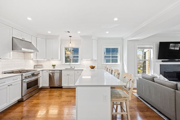 Dining room, Fireplace, Interior, Kitchen, Pendant Lights, Recessed Lighting, Stainless Steel Appliances, Wood Texture Flooring