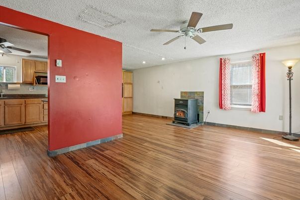 Empty room, Fireplace, Interior, Kitchen, Recessed Lighting, Wood Texture Flooring