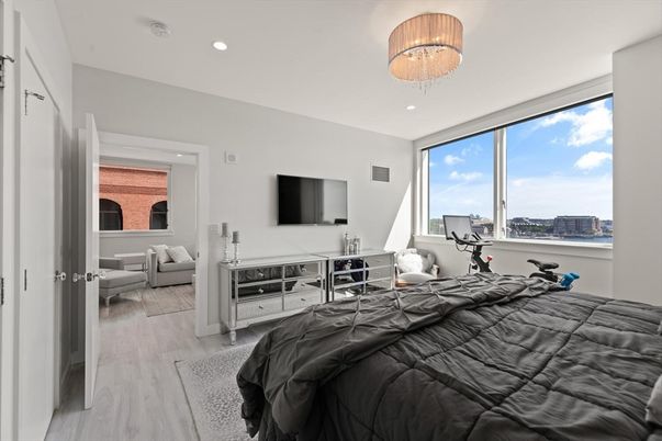 Bedroom, Chandelier, Fitness Equipment, Interior, Recessed Lighting, Wood Texture Flooring