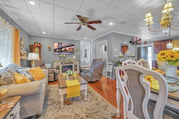 Dining room, Fireplace, Interior, Living room, Recessed Lighting, Wood Texture Flooring
