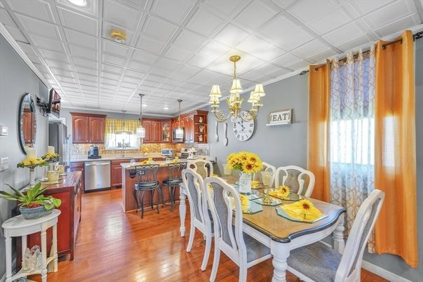 Chandelier, Dining room, Interior, Kitchen, Pendant Lights, Recessed Lighting, Stainless Steel Appliances, Wood Texture Flooring