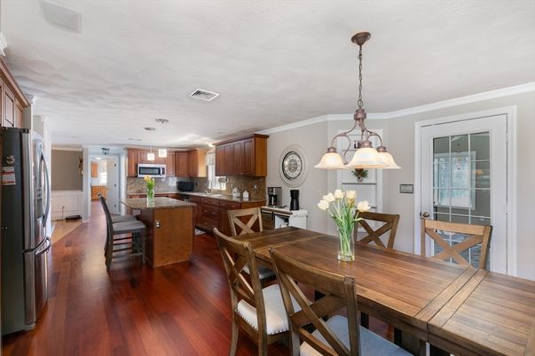 Chandelier, Dining room, Interior, Kitchen, Pendant Lights, Stainless Steel Appliances, Wood Texture Flooring