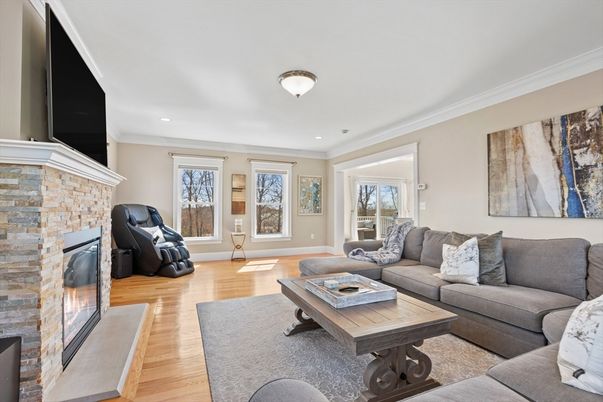 Fireplace, Interior, Living room, Recessed Lighting, Stone Walls, Wood Texture Flooring