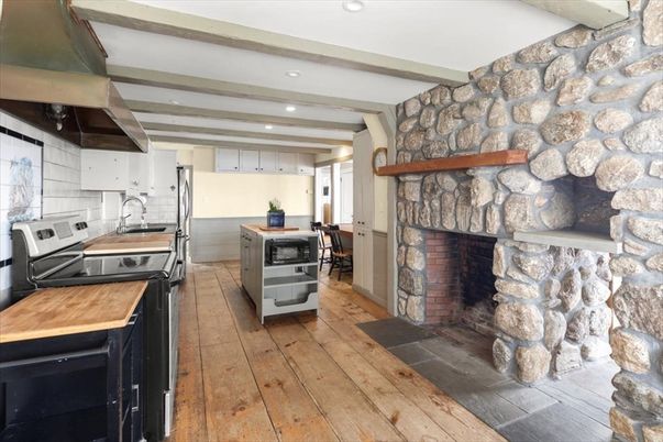 Fireplace, Interior, Kitchen, Recessed Lighting, Stainless Steel Appliances, Stone Walls, Wooden Beams, Wood Texture Flooring