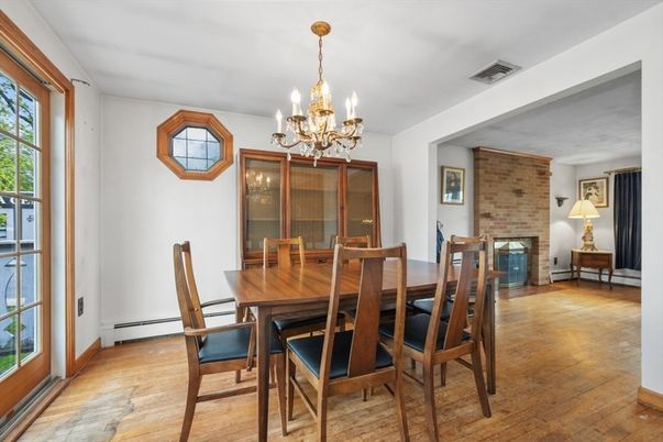Chandelier, Dining room, Fireplace, Interior, Stone Walls, Wood Texture Flooring
