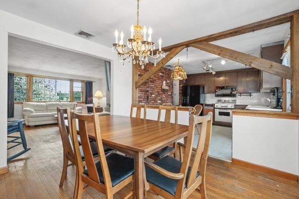 Chandelier, Dining room, Interior, Kitchen, Stainless Steel Appliances, Stone Walls, Wooden Beams, Wood Texture Flooring