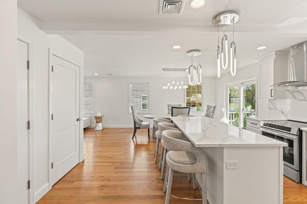 Dining room, Interior, Kitchen, Pendant Lights, Recessed Lighting, Stainless Steel Appliances, Wood Texture Flooring