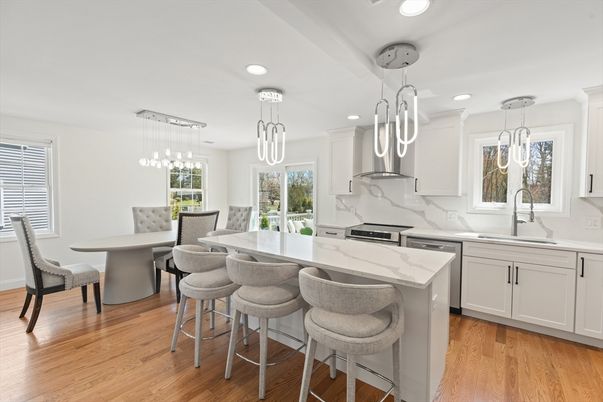 Dining room, Interior, Kitchen, Marble Walls, Pendant Lights, Recessed Lighting, Stainless Steel Appliances, Wood Texture Flooring
