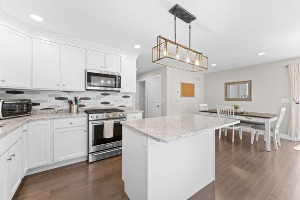 Dining room, Interior, Kitchen, Pendant Lights, Recessed Lighting, Stainless Steel Appliances, Wood Texture Flooring