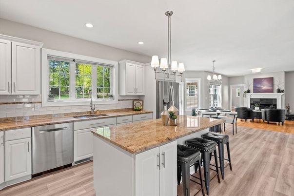 Chandelier, Dining room, Fireplace, Interior, Kitchen, Living room, Pendant Lights, Recessed Lighting, Stainless Steel Appliances, Wood Texture Flooring