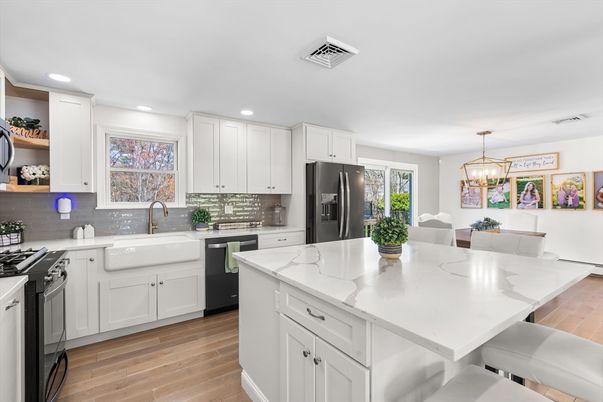 Dining room, Interior, Kitchen, Pendant Lights, Recessed Lighting, Stainless Steel Appliances, Wood Texture Flooring