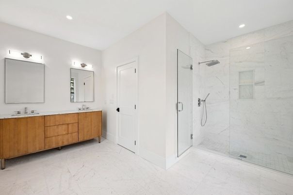 Bathroom, Dual Sink Vanities, Glass Shower, Interior, Marble, Marble Walls, Recessed Lighting