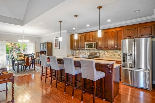 Chandelier, Dining room, Interior, Kitchen, Pendant Lights, Recessed Lighting, Stainless Steel Appliances, Wood Texture Flooring