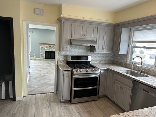 Fireplace, Interior, Kitchen, Stainless Steel Appliances, Wood Texture Flooring