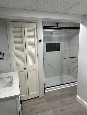 Bathroom, Glass Shower, Interior, Marble Walls, Wood Texture Flooring