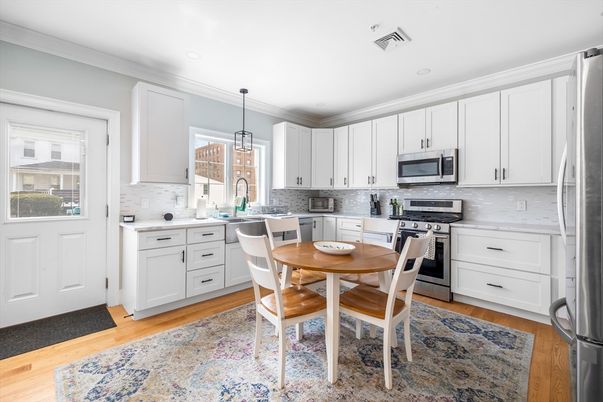 Dining room, Interior, Kitchen, Pendant Lights, Recessed Lighting, Stainless Steel Appliances, Wood Texture Flooring