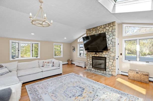 Fireplace, Interior, Living room, Recessed Lighting, Stone Walls, Wood Texture Flooring
