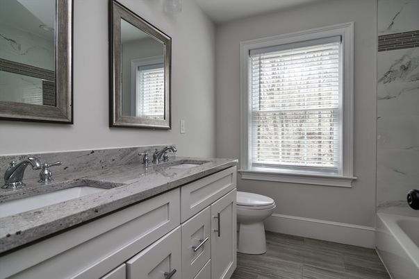 Bathroom, Dual Sink Vanities, Interior, Marble Walls, Wood Texture Flooring