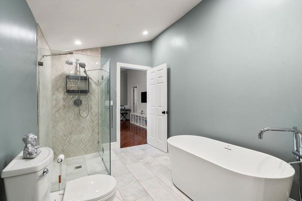 Bathroom, Free Standing Baths, Glass Shower, Interior, Recessed Lighting, Wood Texture Flooring