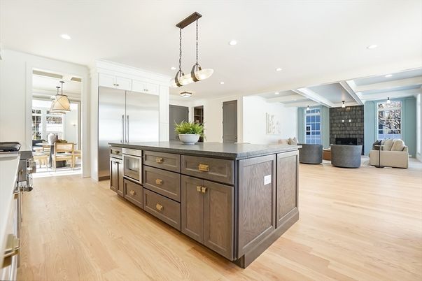 Fireplace, Interior, Kitchen, Living room, Pendant Lights, Recessed Lighting, Stainless Steel Appliances, Wood Texture Flooring