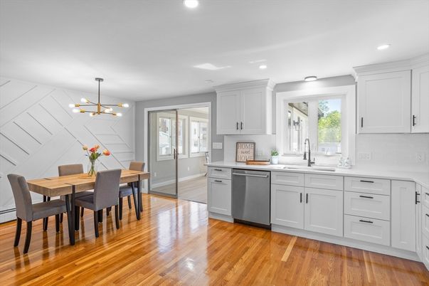 Dining room, Interior, Kitchen, Pendant Lights, Recessed Lighting, Stainless Steel Appliances, Wood Texture Flooring