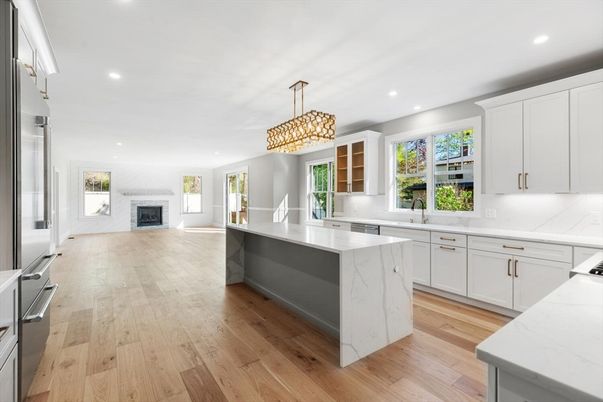 Chandelier, Fireplace, Interior, Kitchen, Recessed Lighting, Stainless Steel Appliances, Wood Texture Flooring