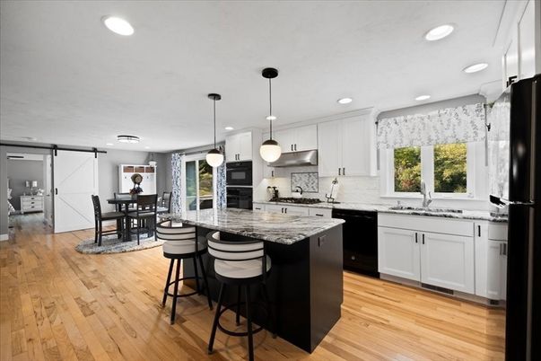 Dining room, Interior, Kitchen, Pendant Lights, Recessed Lighting, Stainless Steel Appliances, Wood Texture Flooring