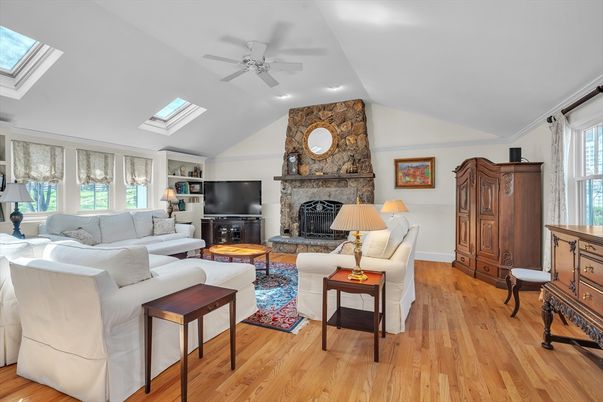 Fireplace, Interior, Living room, Recessed Lighting, Stone Walls, Wood Texture Flooring