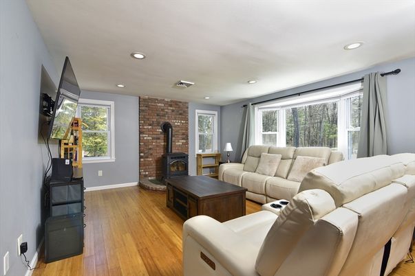 Fireplace, Interior, Living room, Recessed Lighting, Stone Walls, Wood Texture Flooring