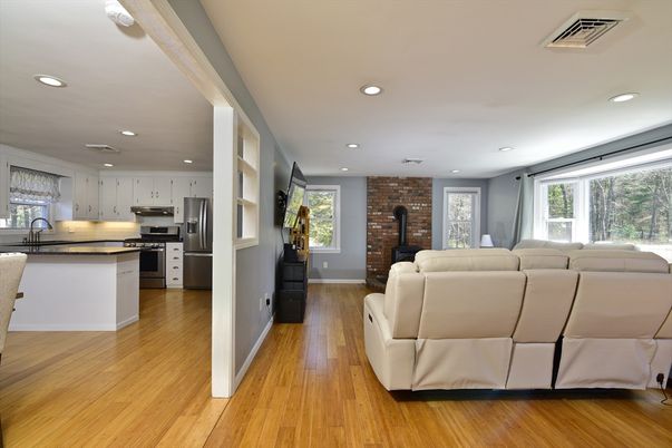 Fireplace, Interior, Kitchen, Living room, Recessed Lighting, Stainless Steel Appliances, Stone Walls, Wood Texture Flooring
