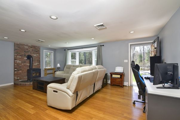 Fireplace, Home Office, Interior, Living room, Recessed Lighting, Stone Walls, Wood Texture Flooring
