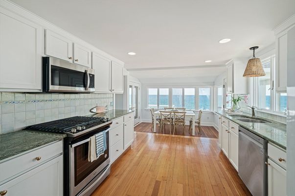 Dining room, Interior, Kitchen, Pendant Lights, Recessed Lighting, Stainless Steel Appliances, Water, Wood Texture Flooring