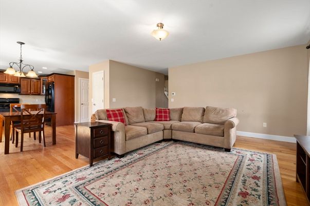 Chandelier, Dining room, Interior, Kitchen, Living room, Stainless Steel Appliances, Wood Texture Flooring