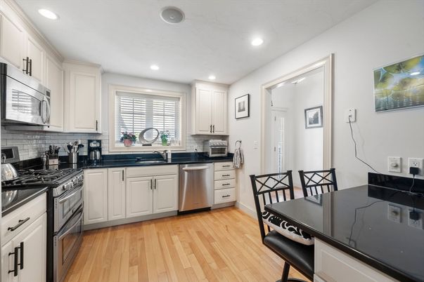 Dining room, Interior, Kitchen, Recessed Lighting, Stainless Steel Appliances, Wood Texture Flooring