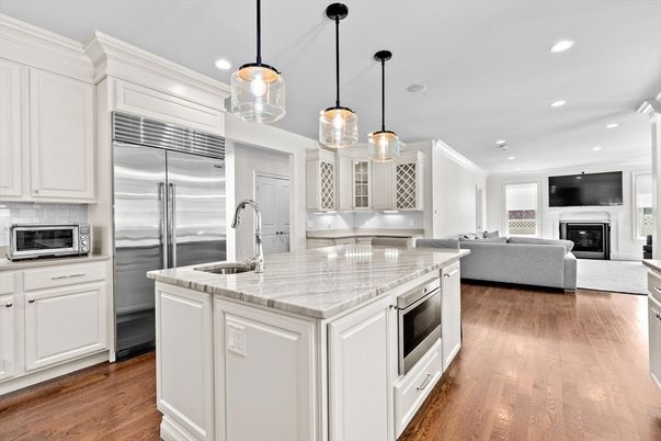 Fireplace, Interior, Kitchen, Living room, Pendant Lights, Recessed Lighting, Stainless Steel Appliances, Wood Texture Flooring