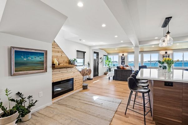 Fireplace, Interior, Living room, Pendant Lights, Recessed Lighting, Water, Wood Texture Flooring, Wooden Walls