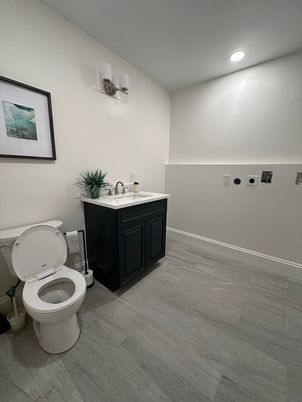 Bathroom, Dual Sink Vanities, Interior, Recessed Lighting, Wood Texture Flooring